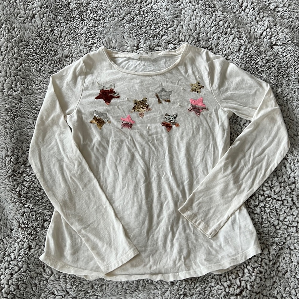 Sequined long sleeved white tee.
